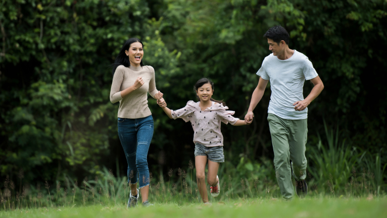 Family playing in a park