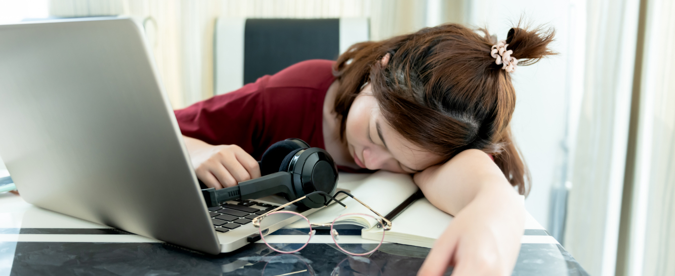 Girl falling asleep on the desk